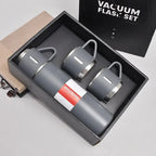 Gray vacuum flask set with two matching mugs in gift box, insulated hot cold drinkware kit