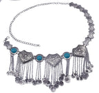 Boho silver coin belt with turquoise accents and intricate engraved details, fashion accessory.
