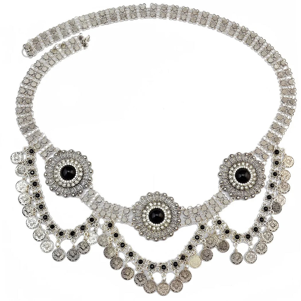 Silver decorative necklace with ornate medallion pendants and dangling coin charms