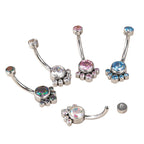 Set of jeweled curved barbell belly button rings in assorted colors on white background