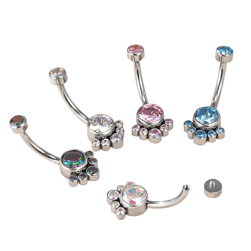 Set of jeweled curved barbell belly button rings in assorted colors on white background