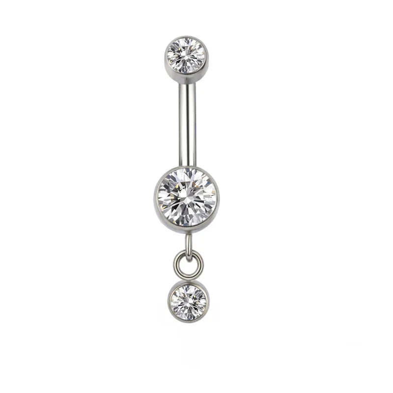 Silver belly button ring with three clear round gemstones on white background