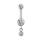 Silver belly button ring with three clear round gemstones on white background