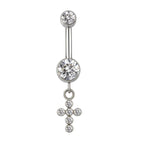 Silver belly button ring with clear gemstones and a dangling cross charm