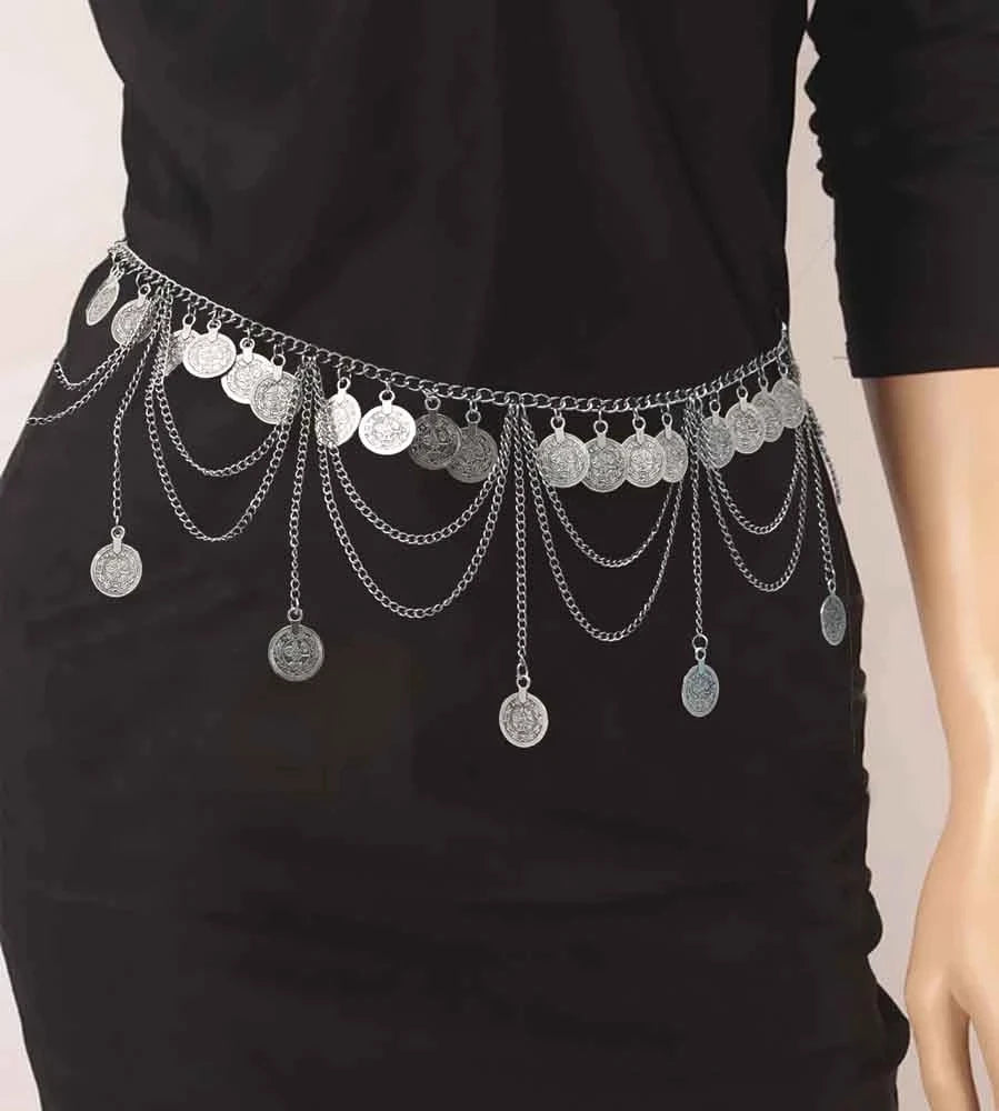 Silver coin chain belt with layered chains on a black dress, fashion accessory