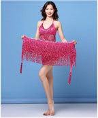 Woman modeling pink sequin fringe dance costume with halter top and matching skirt wrap
